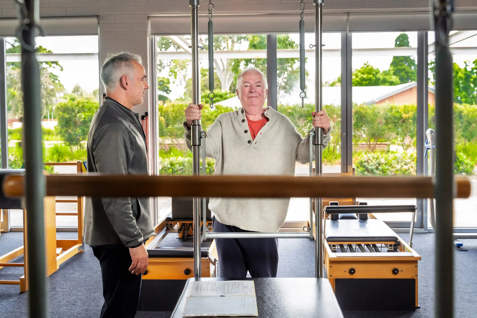 Instructor working with elderly client